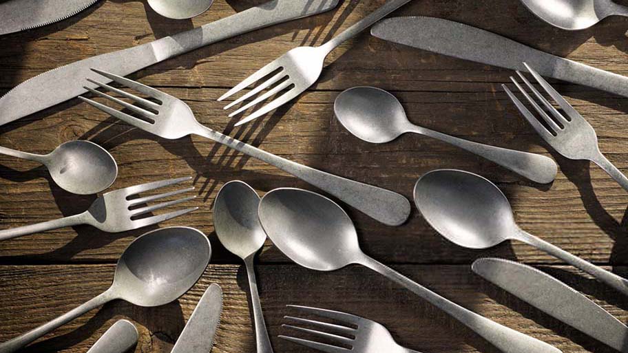 What is Stonewashed Cutlery A close-up of a stonewashed fork and knife, highlighting their unique matte and textured finish