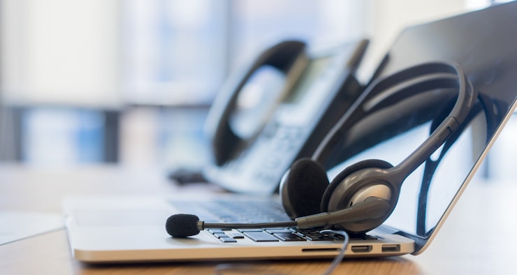 A customer service person having a friendly and professional video call with a client