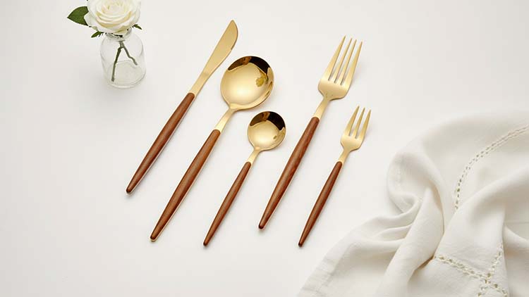 A stylish overhead shot of the W002 cutlery, highlighting the iconic slender silhouette against a dark background.