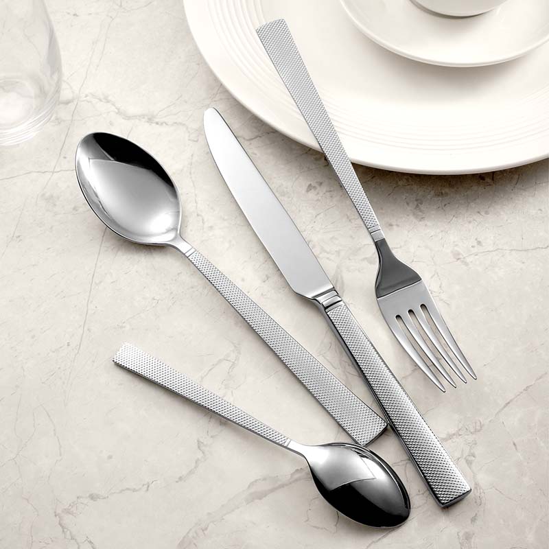 Textured hammered finish detail on stainless steel fork knife spoon set