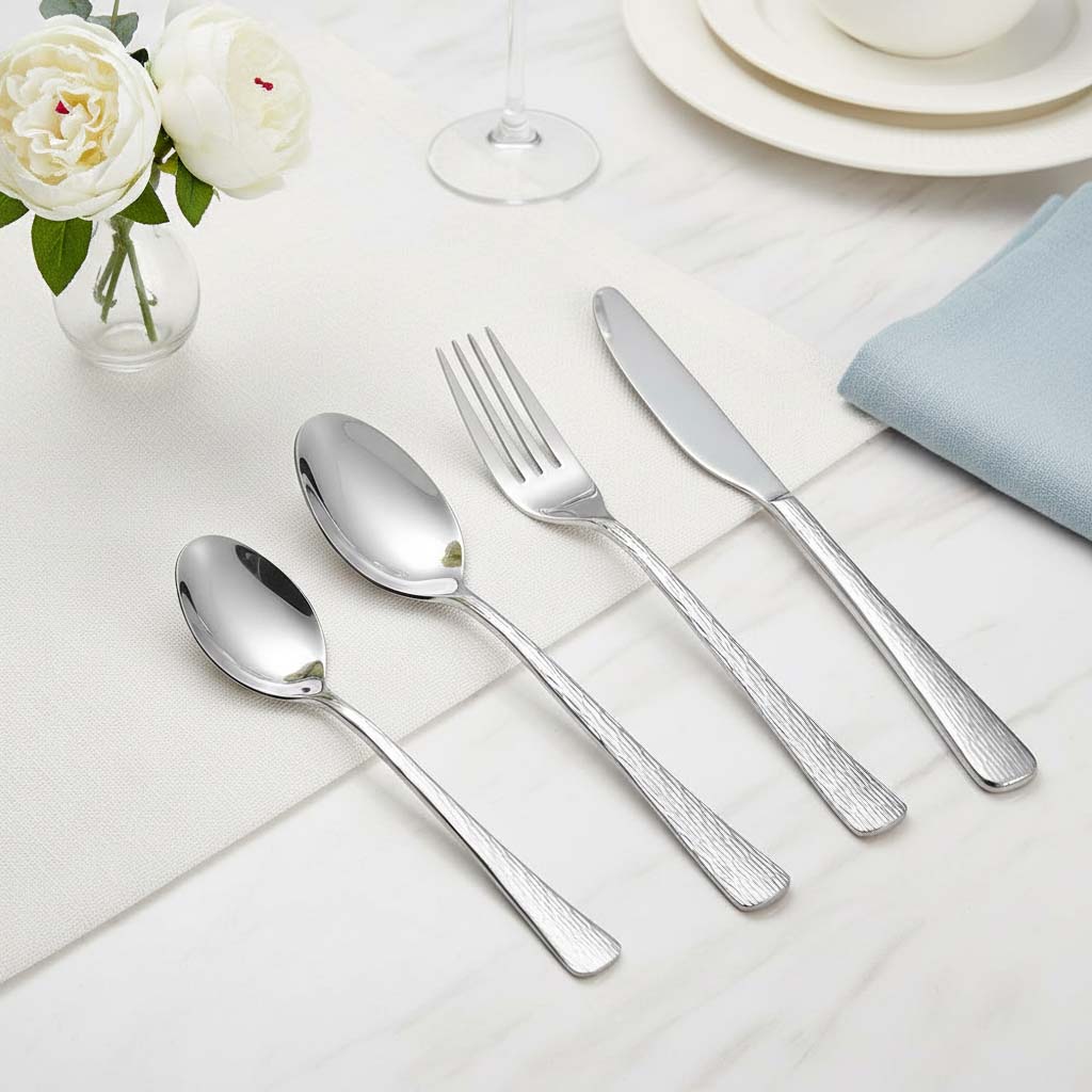 Textured hammered finish detail on stainless steel spoon fork knife set
