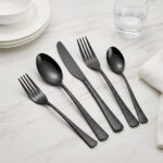 Black finish detail on modern stainless steel spoon fork knife set