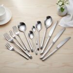 Round cylinder handle detail on stainless steel spoon fork knife set