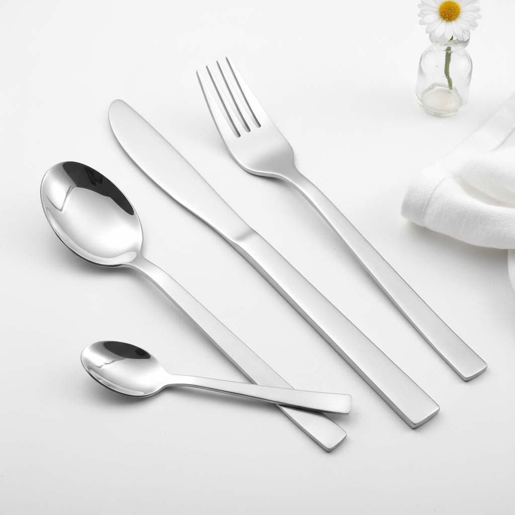 Brushed handle and mirror finish fork knife spoon detail on stainless steel flatware