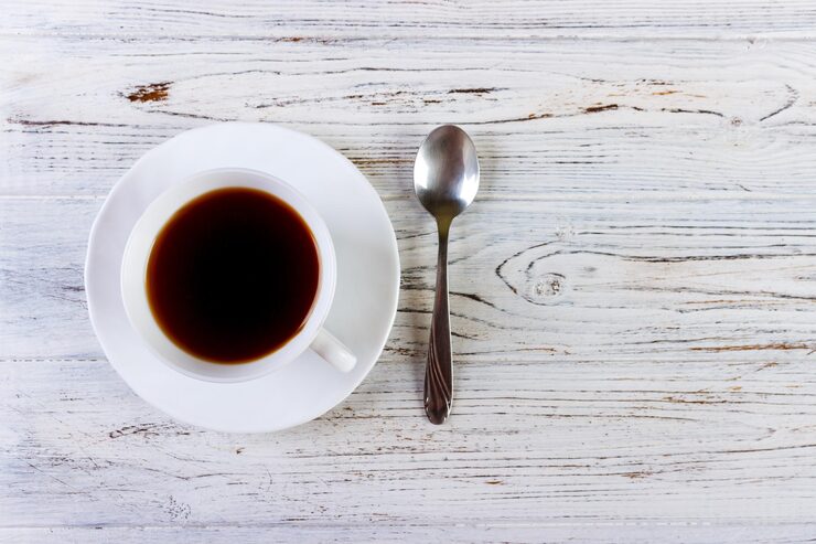 Coffee Spoon Size Comparison A ruler next to a coffee spoon, a teaspoon, and an espresso spoon showing their different lengths.