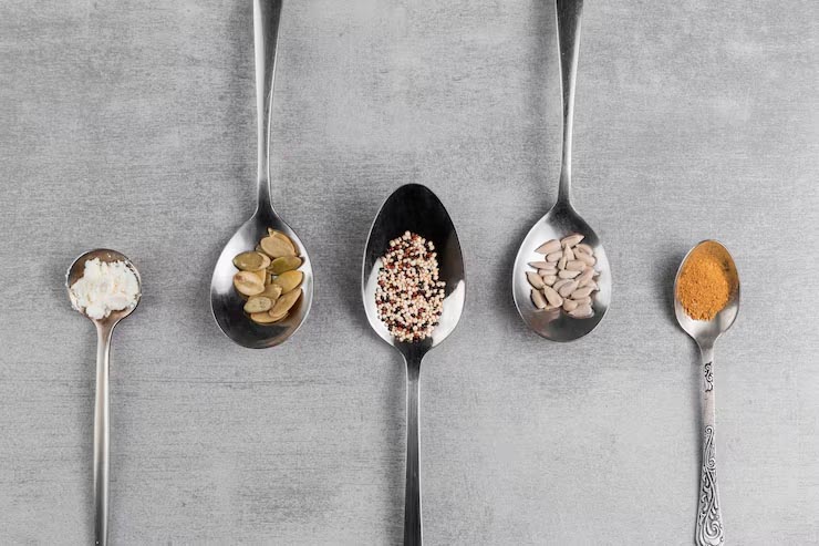 Spoon Volume Comparison A coffee spoon, a teaspoon, and a tablespoon with their approximate volumes written below them.
