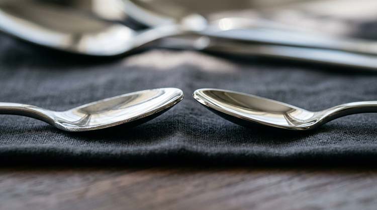 A side-by-side comparison of a poorly finished fork and a well-finished one