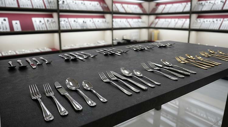 A collection of stainless steel flatware neatly arranged