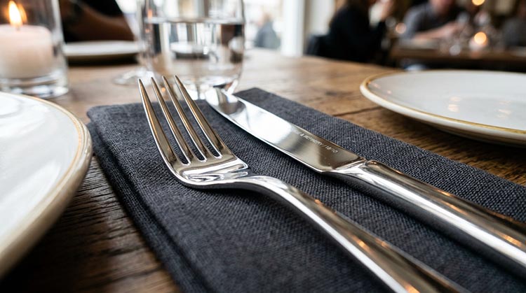 Consistent Flatware Quality Close-up of a perfectly polished fork and knife showing consistent quality