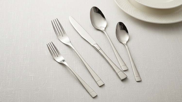 A collection of stainless steel flatware with different handle designs