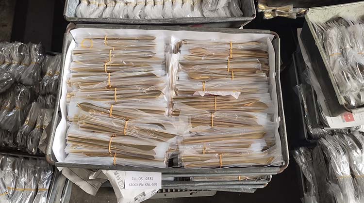 Consistent Flatware Quality in Manufacturing A large batch of stainless steel forks showcasing consistent flatware quality from mass production