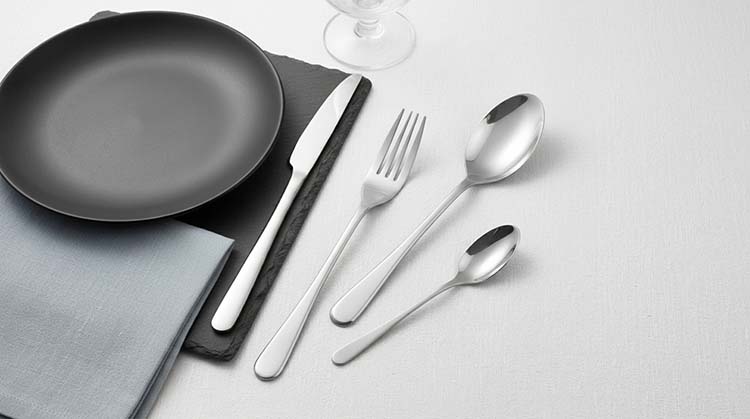 Engineers at a China flatware manufacturer reviewing a CAD drawing for a new OEM cutlery design.