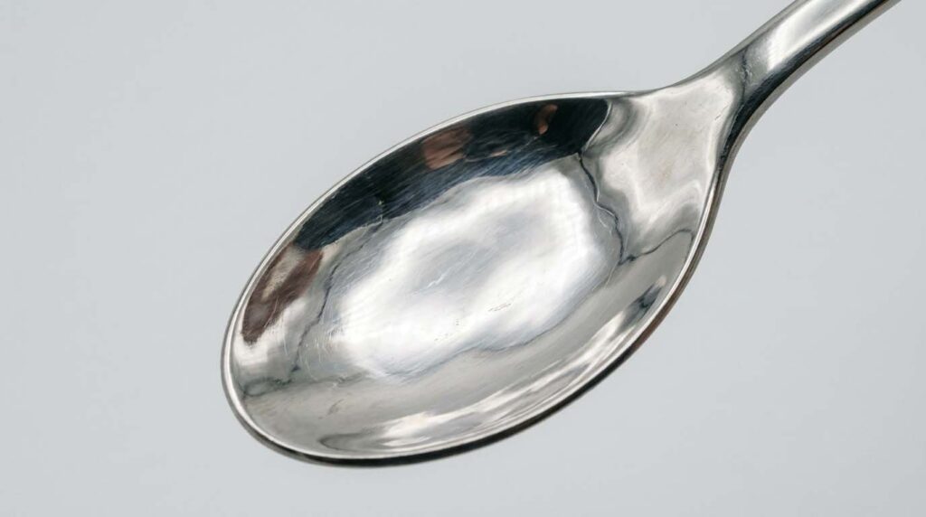 Common Quality Problems in Stainless Steel Flatware a close-up view of common quality problems in stainless steel flatware like scratches and rust spots