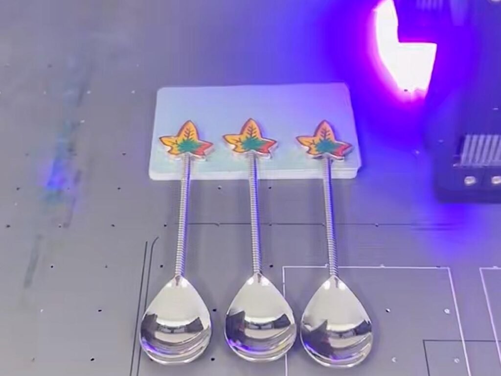 Testing Durability of UV Printing on Stainless Steel Cutlery Technician examining the adhesion of UV printing on stainless steel cutlery with a cross-hatch test